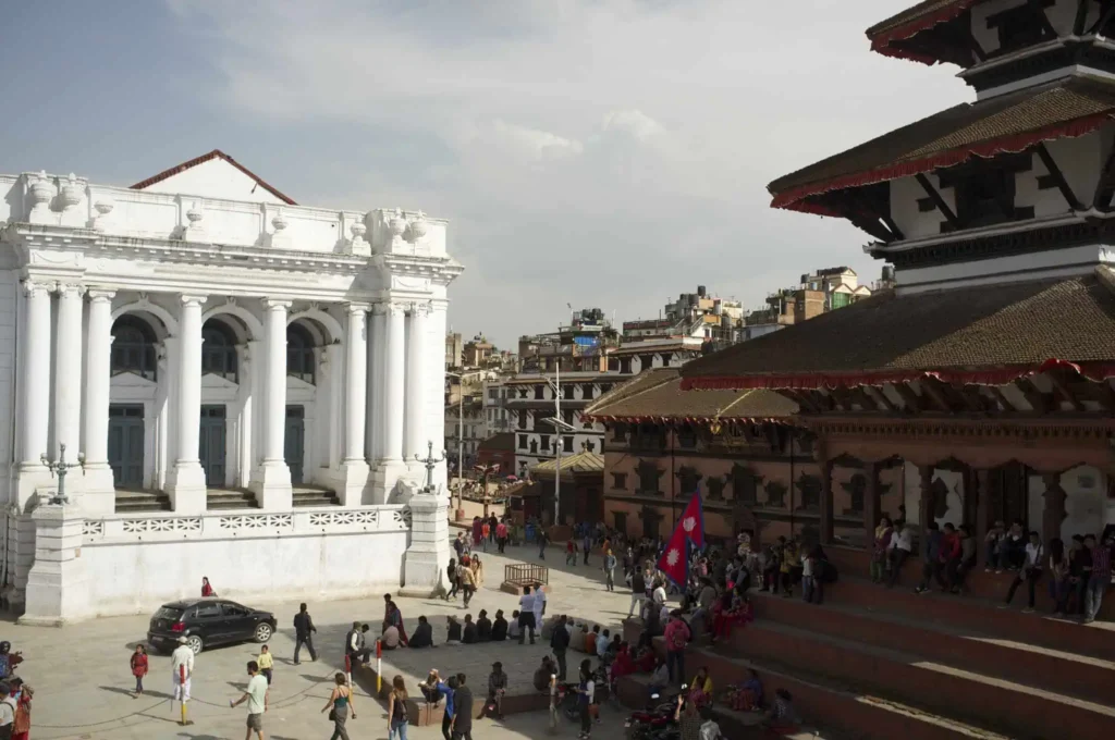 Historic buildings in a bustling square.