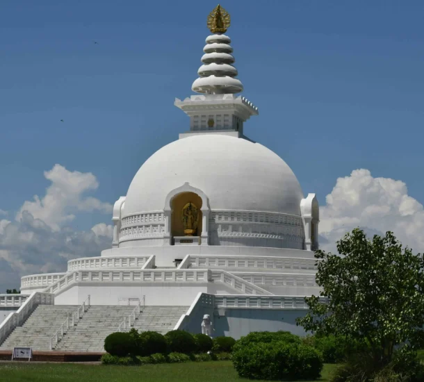 White stupa against blue sky seen from Kathmandu to Lumbini tour package