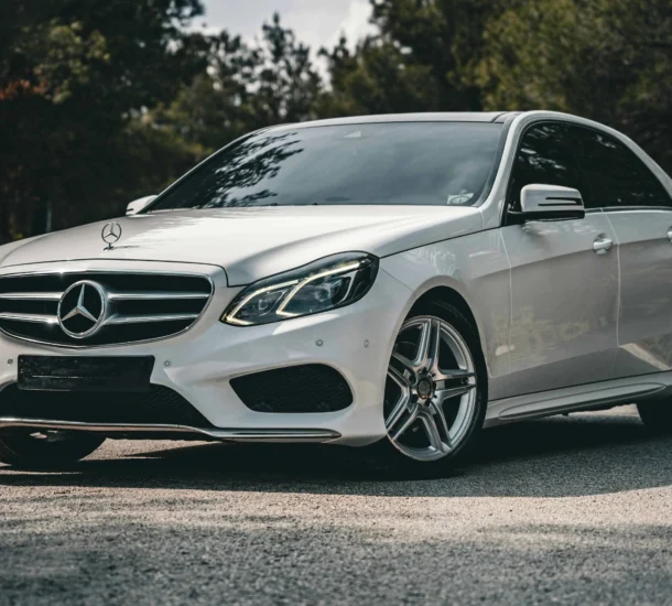 Sleek white luxury sedan on road
