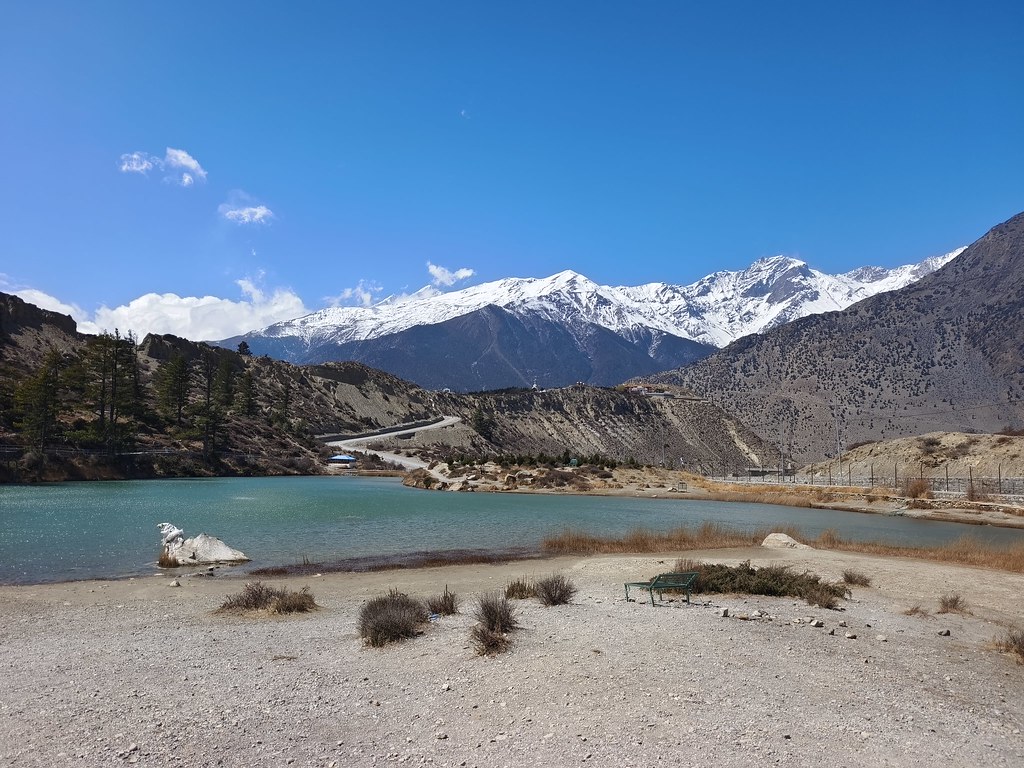 Turquoise Himalayan lake with snow peaks