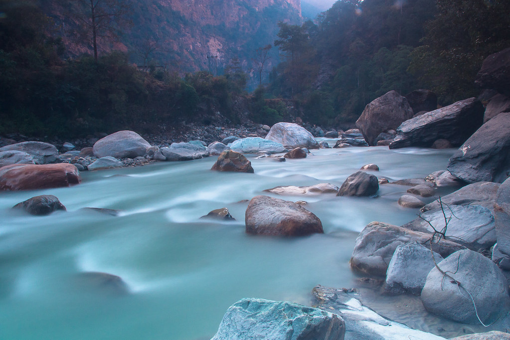 Serene mountain river with boulders