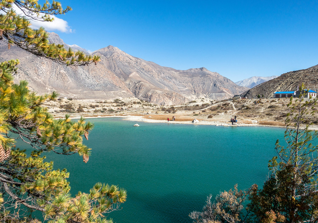 Turquoise Himalayan lake with rocky mountains