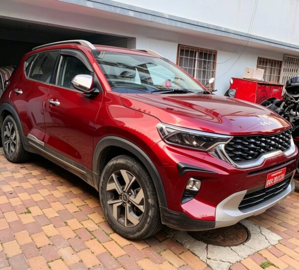 Kathmandu to Ilam by Private Car red Kia SUV on driveway
