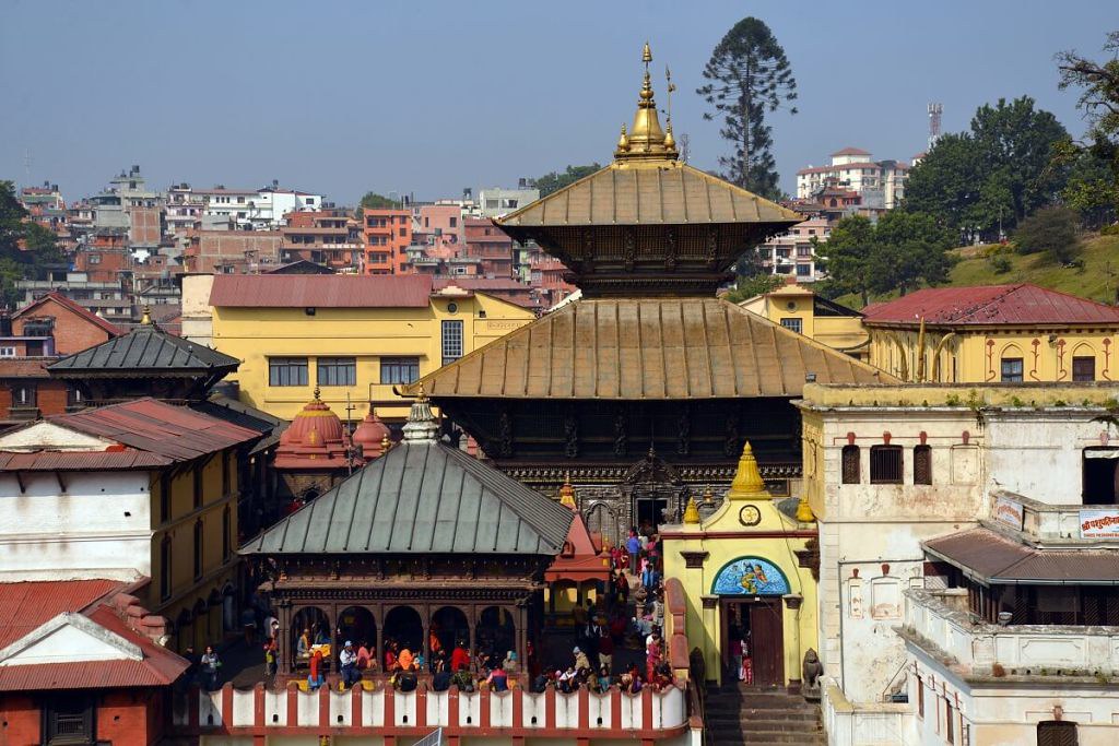 Women Travelers in Nepal visiting Pashupatinath Temple with golden tiered roof and cultural heritage